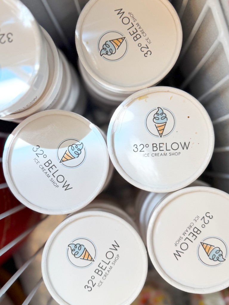 Stacked 32° Below branded pint lids in the shop freezer
