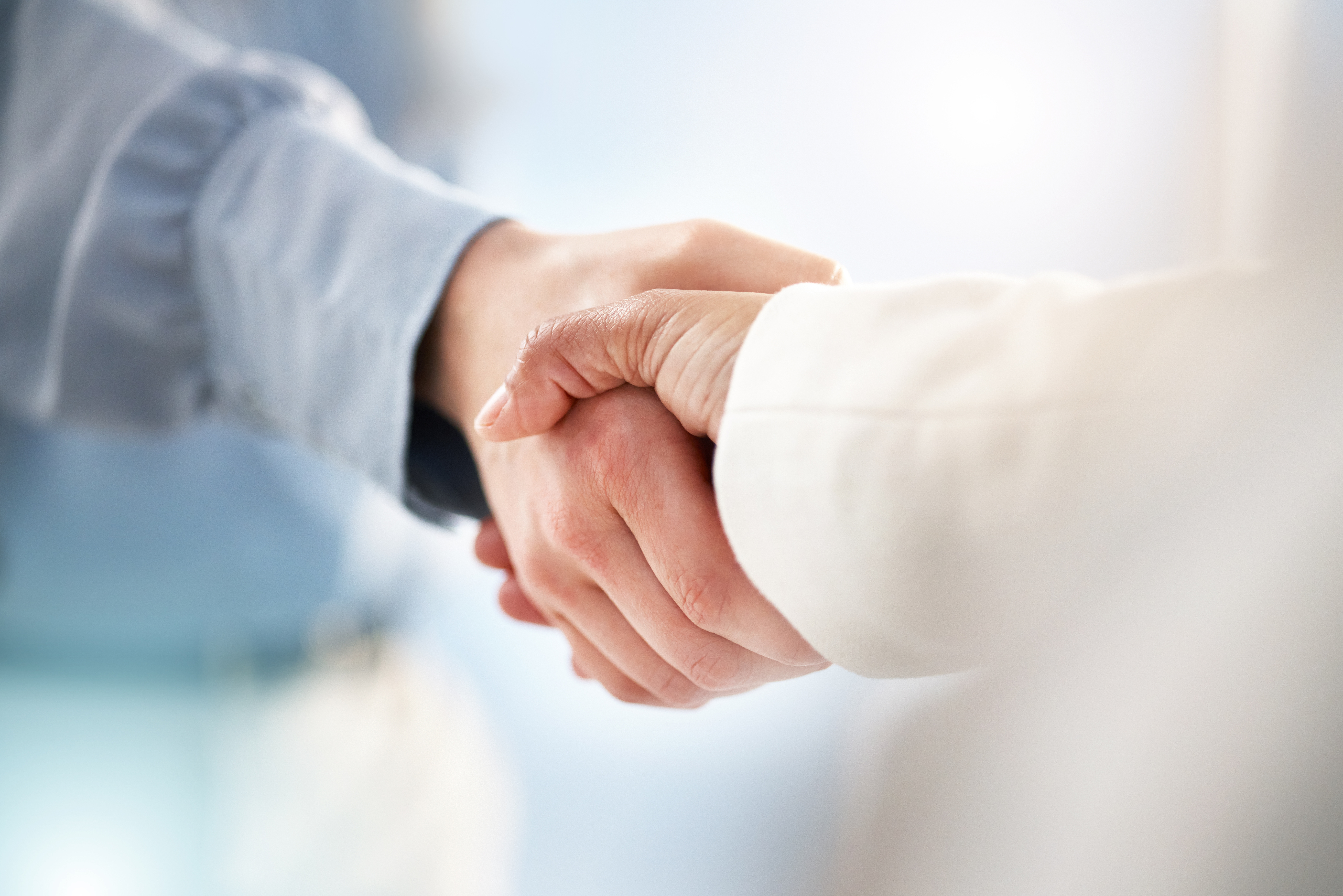 Handshake partnership photography for Baker Accounting brand mood