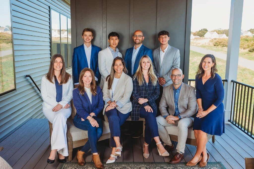 Brad Zimmerman Team outdoor group portrait on a covered porch