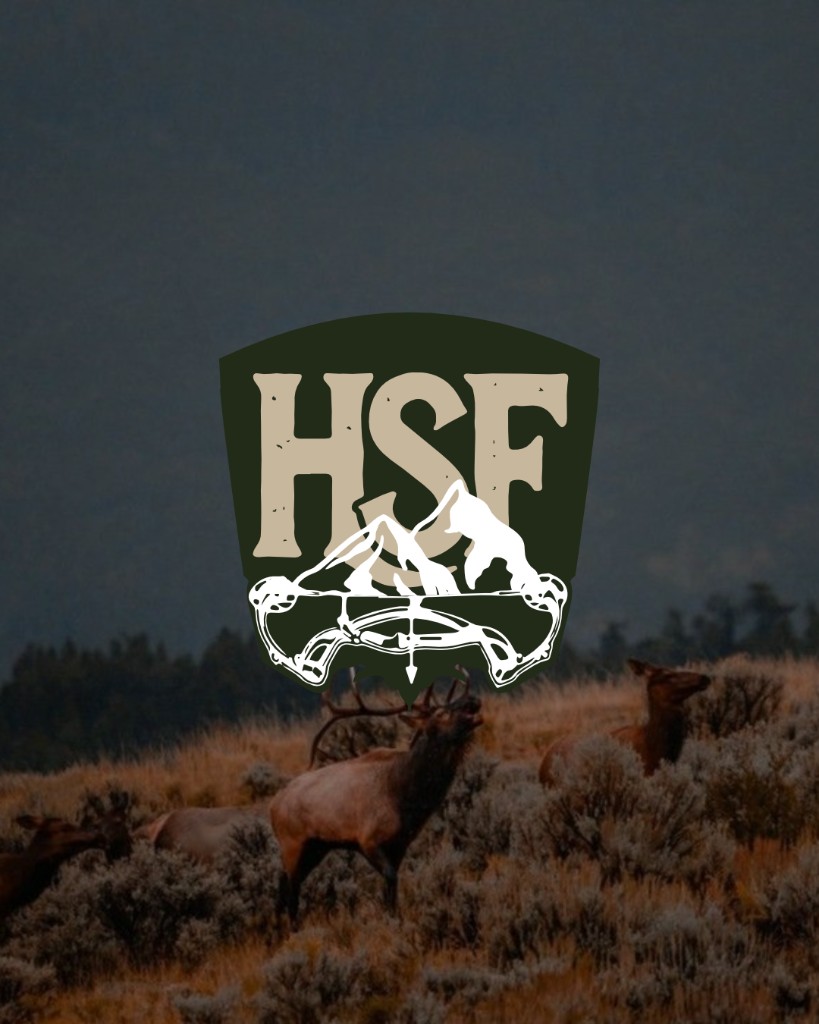 Head Strong Flight logo over elk in a moody field at dusk