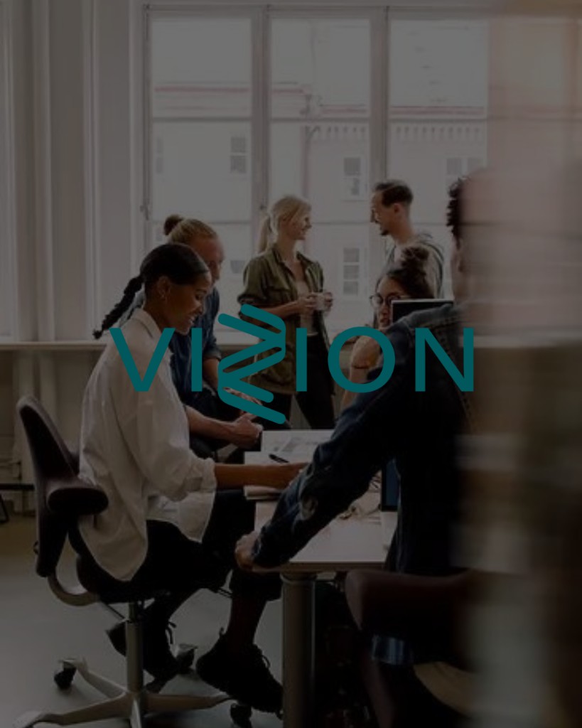 Vizion wordmark over a dimmed office collaboration scene