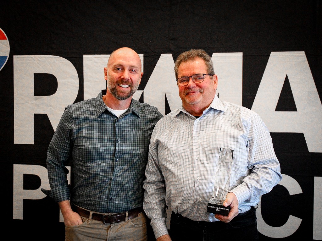 RE/MAX Pinnacle agents with a Chairman's Club team award for the Greg Grogan Team