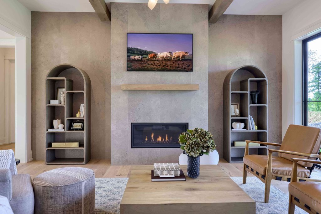 Pine Hill Building Company living room with a stone fireplace