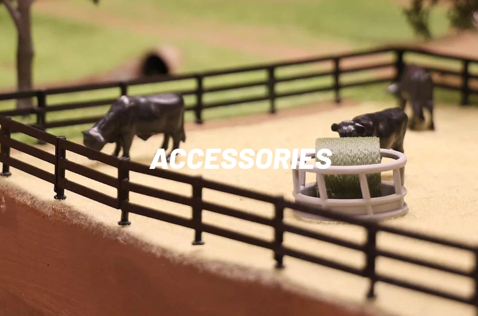 REVD toy cattle and a hay feeder in a fenced pasture, labeled Accessories